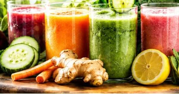 Four fresh detox juices — beetroot, carrot, greens and watermelon — with cucumber, ginger and lemon